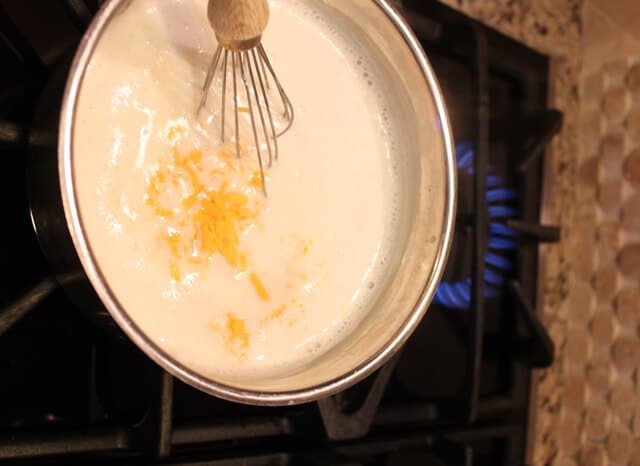 Remove the pan from the heat before adding the cheese to avoid curdling.