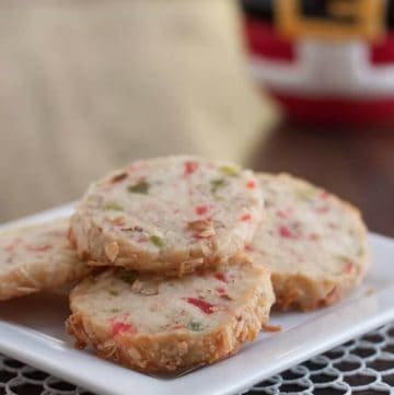 Santa's Whiskers Cookies are a shortbread cookie with candied fruit, nuts and coconut to make a fun and festive way to celebrate the holidays! Easy to make ahead too.