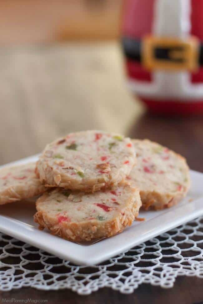 Santa's Whiskers Cookies are a shortbread cookie with candied fruit, nuts and coconut to make a fun and festive way to celebrate the holidays! Easy to make ahead too.