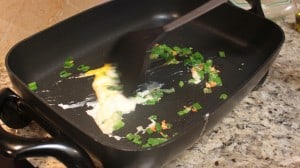 Scrambling an egg for an easy Pad Thai recipe