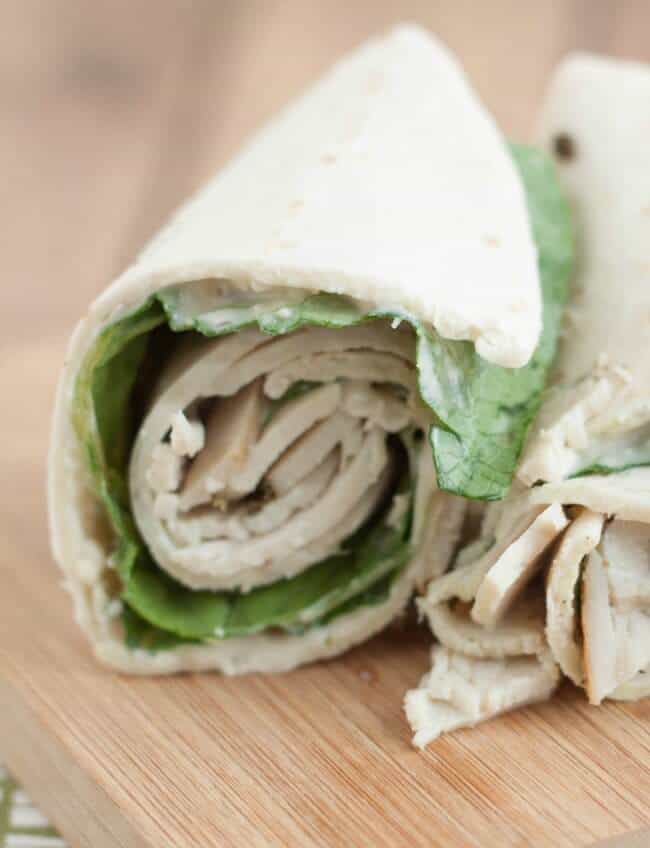 This Chicken Caesar salad wrap is a delicious sandwich wrap combining chicken lunch meat with a fresh Caesar salad! Perfect make ahead meal for lunch boxes!