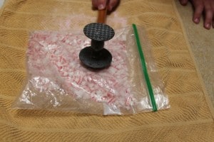 peppermint candy being smashed with a kitchen mallet