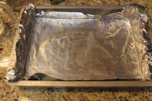 baking pan covered with aluminum foil and greased with butter