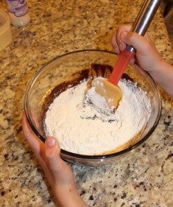 mixing the batter to make brownie cake balls