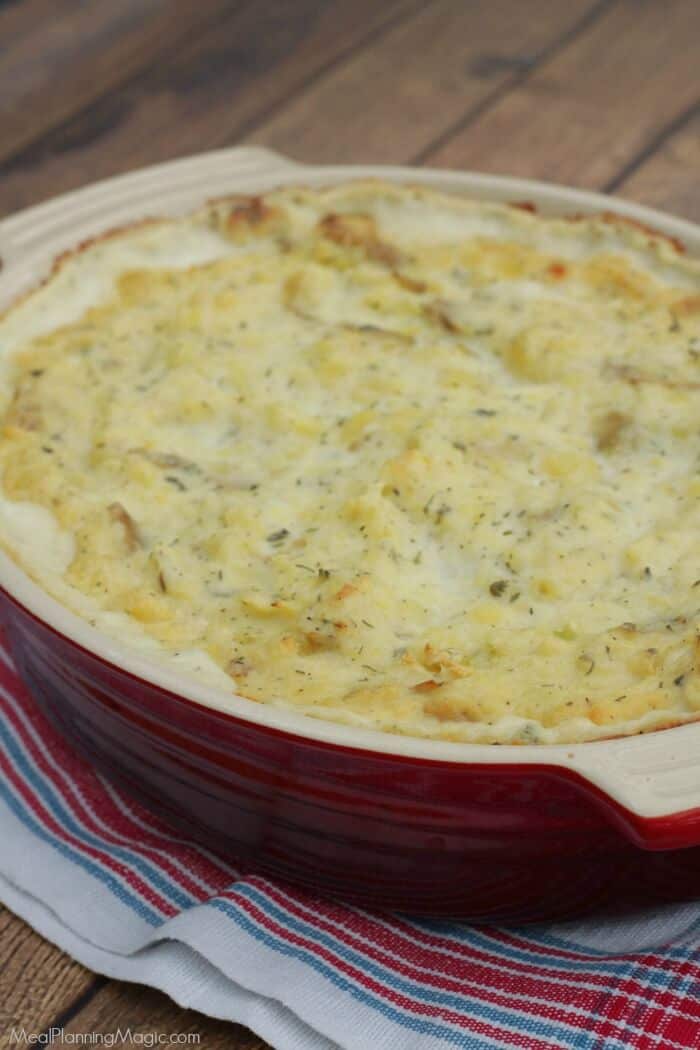 Make ahead and freezer friendly? You won't believe how easy this Garlic Herb Mashed Potatoes Casserole is to make and have on hand for any occasion! | Get the recipe at MealPlanningMagic.com