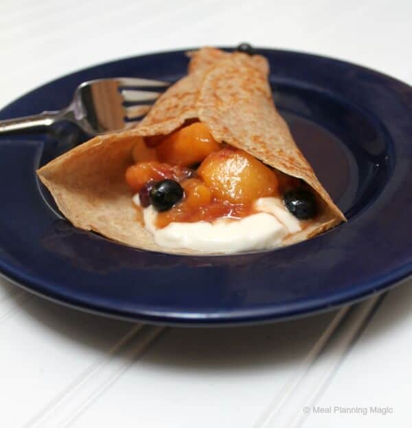 Nectarine-Blueberry Fruit Sauce is delicious folded into crepes with whipped cream | MealPlanningMagic.com