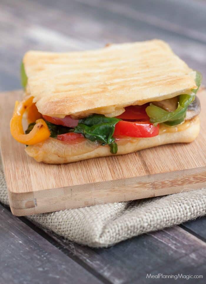 Packed with bell peppers, onions, mushrooms and spinach, this Simple Sauteed Vegetable Panini can be made in under 15 minutes. Perfect for lunch or dinner! | Recipe at MealPlanningMagic.com