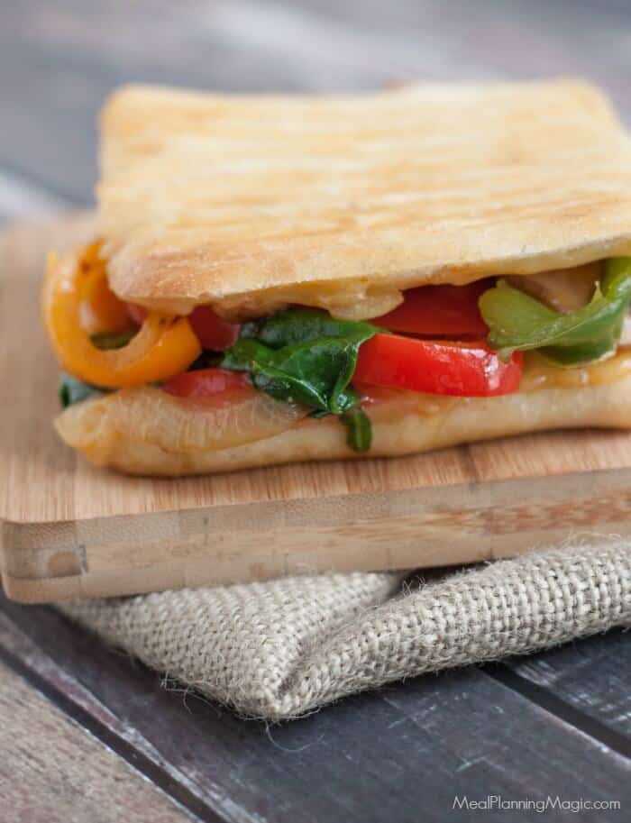 Packed with bell peppers, onions, mushrooms and spinach, this Simple Sauteed Vegetable Panini can be made in under 15 minutes. Perfect for lunch or dinner! | Recipe at MealPlanningMagic.com