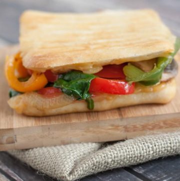 Packed with bell peppers, onions, mushrooms and spinach, this Simple Sauteed Vegetable Panini can be made in under 15 minutes. Perfect for lunch or dinner! | Recipe at MealPlanningMagic.com