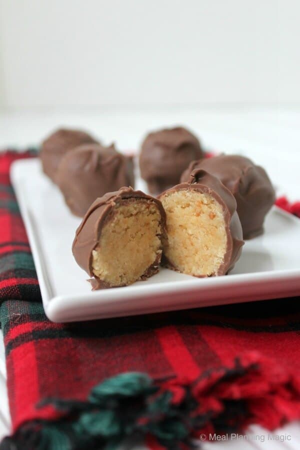 Double Peanut Butter Chocolate Covered Cake Balls - This cake balls from scratch recipe has homemade peanut butter cake on the inside and homemade peanut butter frosting on the outside! The freeze well, too! | 12 Weeks Christmas Treats Blog Hop | from MealPlanningMagic.com