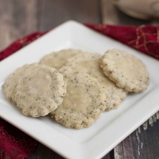 Image of Vanilla Chai Shortbread Cookies on plate with red fabric.