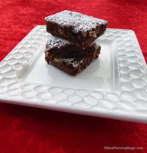 Black Forest Brownies are fudgy brownies with sweet chocolate, crunchy nuts, and cherries.