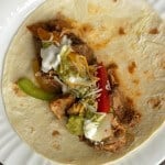 Simple Slowcooker Steak and Chicken Fajitas are a delicious and easy way to enjoy at Texas regional specialty. Perfect for a weeknight--or when company's visiting! Find the recipe at MealPlanningMagic.com