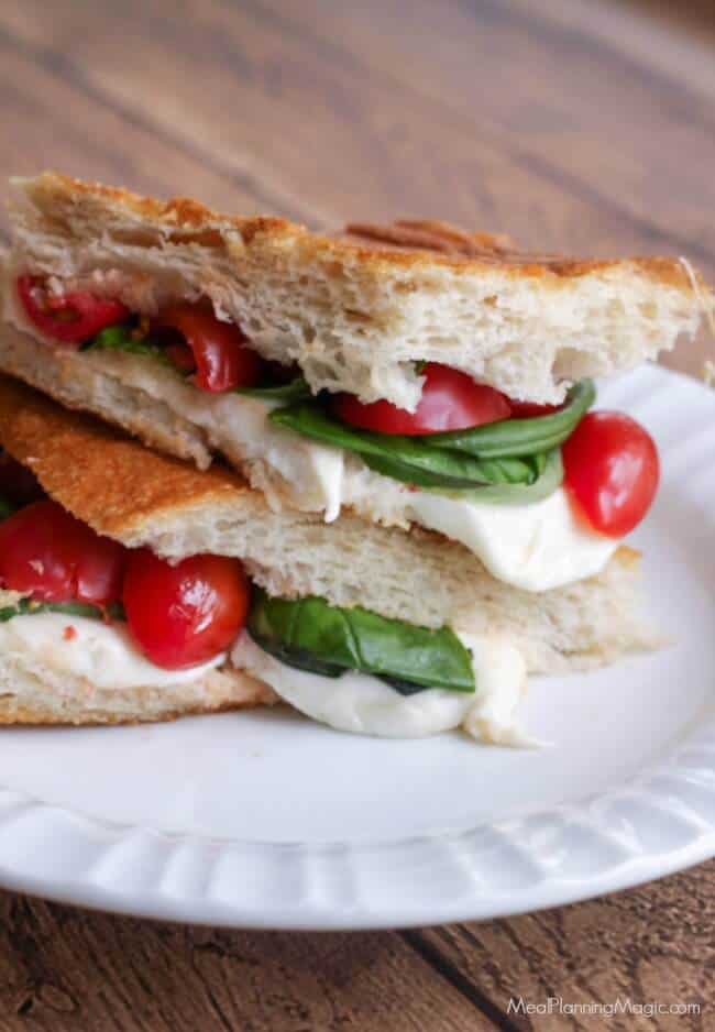 This Simple Caprese Panini (with Tomato, Basil and Mozzarella) bursts with garden fresh flavor and it's SO super easy to put together! It may just become your new favorite! | Recipe at MealPlanningMagic.com