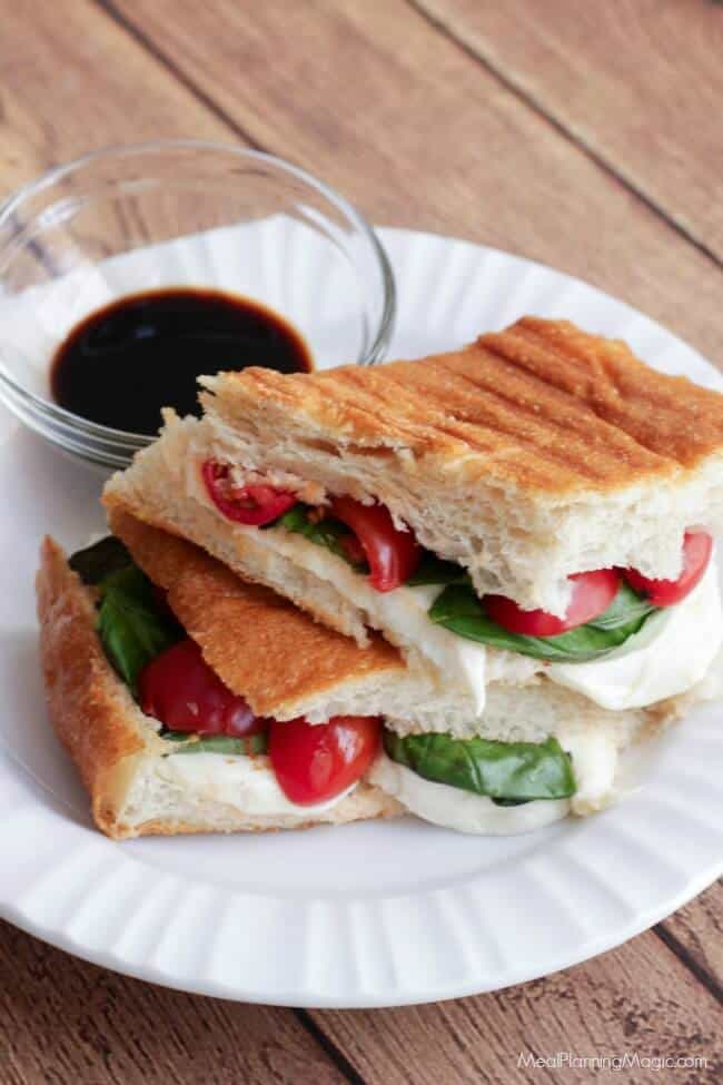 This Simple Caprese Panini (with Tomato, Basil and Mozzarella) bursts with garden fresh flavor and it's SO super easy to put together! It may just become your new favorite! | Recipe at MealPlanningMagic.com