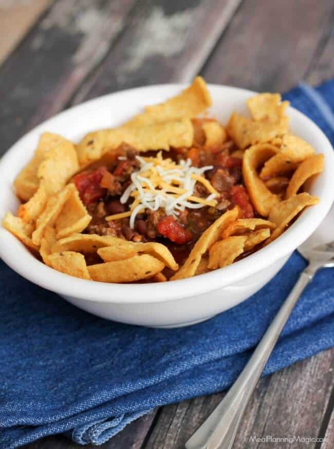 You can enjoy chili year round with Slowcooker Cowboy Chili Frito Pie! Full of better-for-you ingredients, indulge your cravings with this flavorful version! | Recipe at MealPlanningMagic.com