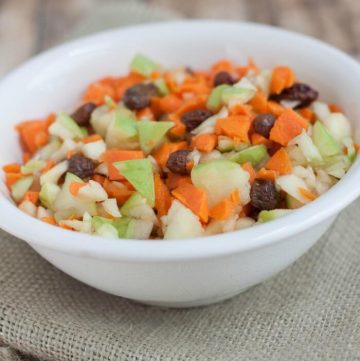 This Carrot Apple Raisin Salad is SO super simple and with a citrus dressing it will become a family favorite! | Get the recipe at MealPlanningMagic.com