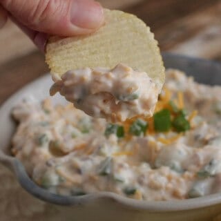 Loaded Baked Potato Dip-only four ingredients and oh, so delicious! It's one of our all-time favorite dips and perfect for any occasion! Get the recipe at MealPlanningMagic.com