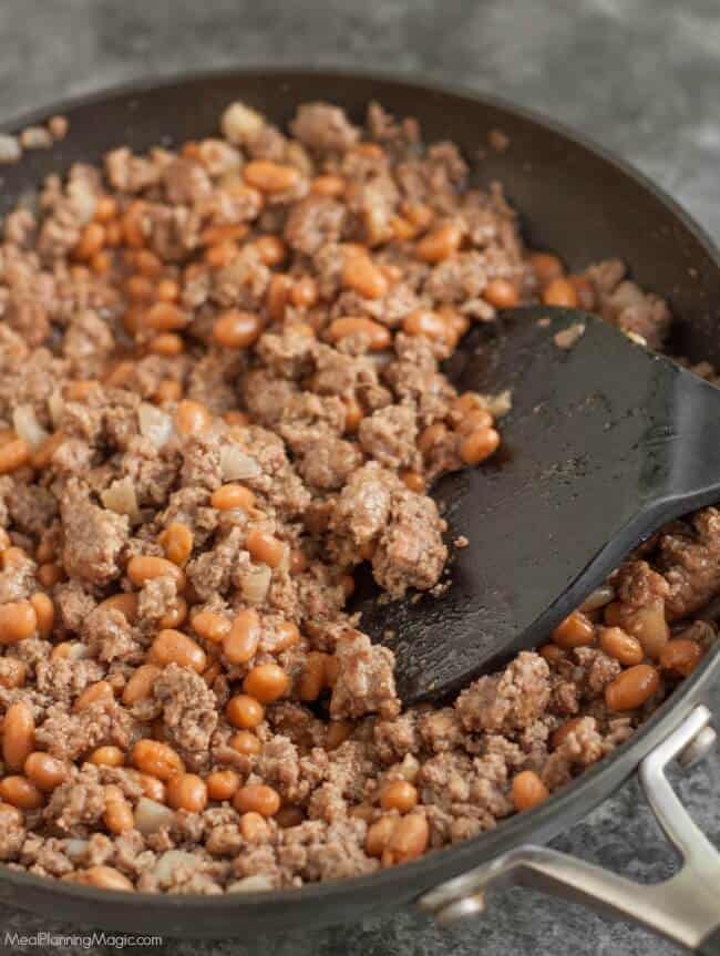 With just a few ingredients, these Easy Beef and Bean Burritos are not only simple to whip up, they are also budget friendly. They are a family favorite! Recipe at MealPlanningMagic.com