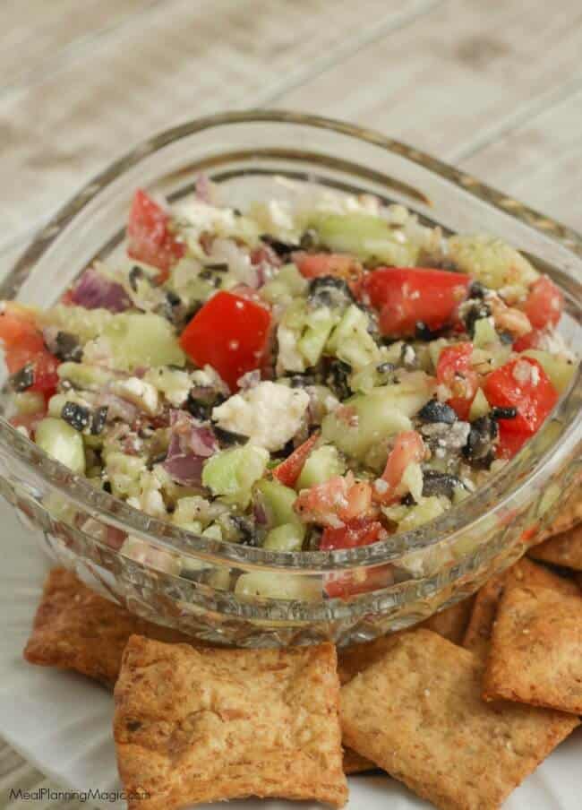 This veggie filled Mediterranean Salsa Dip is so fresh, delicious and super simple! Serve it with pita chips or as a side to grilled chicken or seafood. Find the recipe at MealPlanningMagic.com