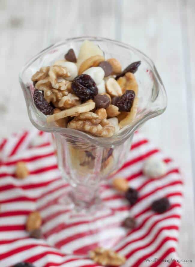 Banana Split Trail Mix is full of protein and nutrient rich nuts and dried fruit like banana chips, pineapple, cherries and just a touch of chocolate for a healthier treat on the go! 