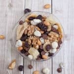 Banana Split Trail Mix is full of protein and nutrient rich nuts and dried fruit like banana chips, pineapple, cherries and just a touch of chocolate for a healthier treat on the go! Recipe at MealPlanningMagic. com