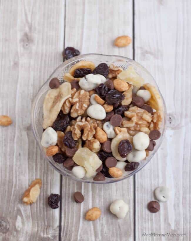 Banana Split Trail Mix is full of protein and nutrient rich nuts and dried fruit like banana chips, pineapple, cherries and just a touch of chocolate for a healthier treat on the go! Recipe at MealPlanningMagic. com