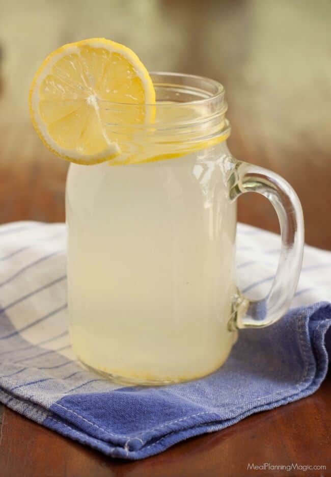 Making your own Homemade Lemonade Concentrate for the Freezer is super easy and lets you enjoy fresh lemonade year round! Get the recipe at MealPlanningMagic.com