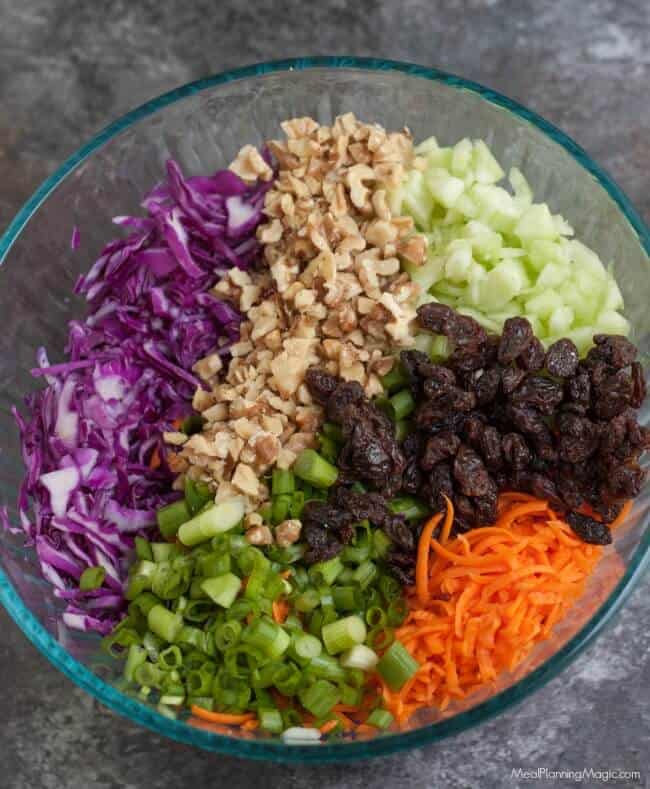 Filled with good for you vegetables, nuts and dried fruits, this Trailmix Coleslaw is easy to make ahead and do delicious too!