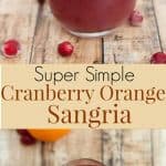 Cranberry Orange Sangria in a glass with cranberries and orange slice floating at top and whole orange at upper left of glass.