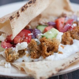 These Simple Greek Tacos are bursting with fresh vegetables, falafel and Greek seasoned ground beef, are a family favorite and really are so simple!