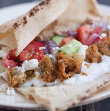 These Simple Greek Tacos are bursting with fresh vegetables, falafel and Greek seasoned ground beef, are a family favorite and really are so simple!