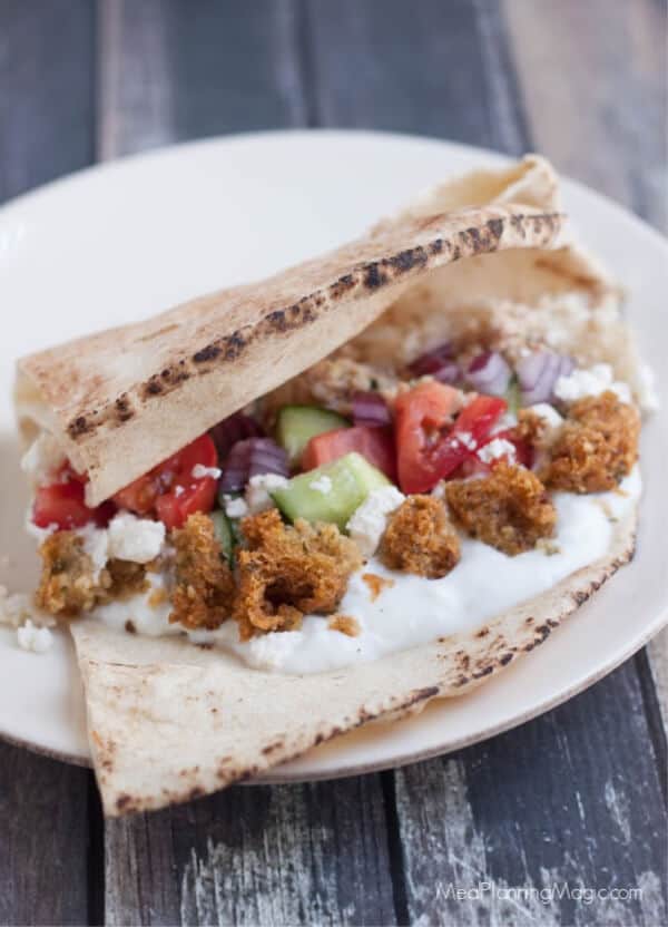 These Simple Greek Tacos are bursting with fresh vegetables, falafel and Greek seasoned ground beef, are a family favorite and really are so simple!