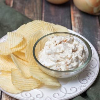 Image of Homemade French Onion Dip with chips on a plate with Vidalia Onions.