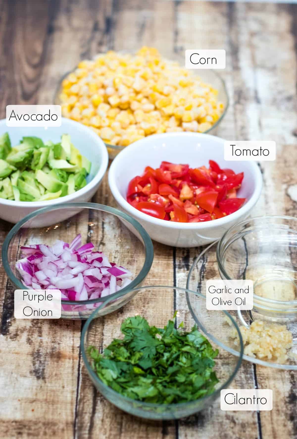 Image of ingredients for corn, avocado and tomato salsa.