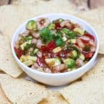 Shrimp Avocado Salsa in a bowl surrounded by tortilla chips.