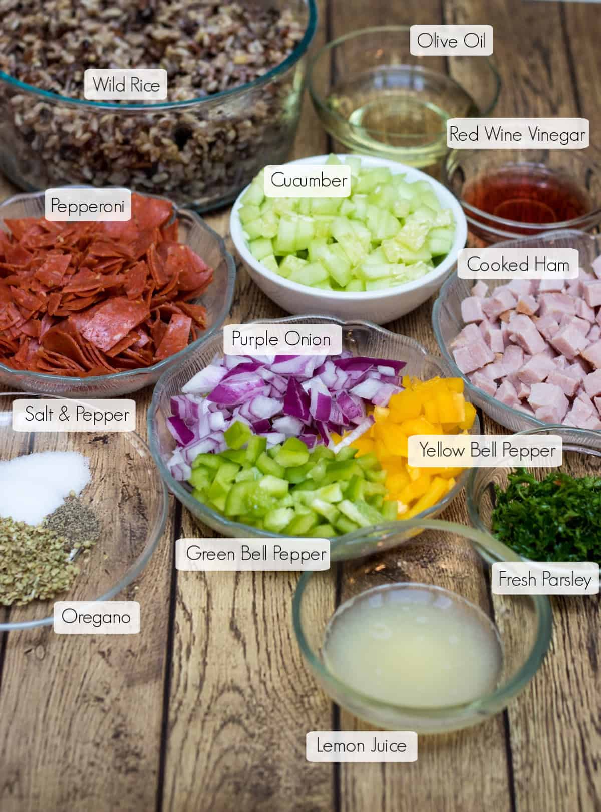 Labeled ingredients in bowls for Italian Vegetable Wild Rice Salad