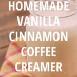 Glass jar of homemade cinnamon vanilla coffee creamer on a multi colored napkin with text overlay.