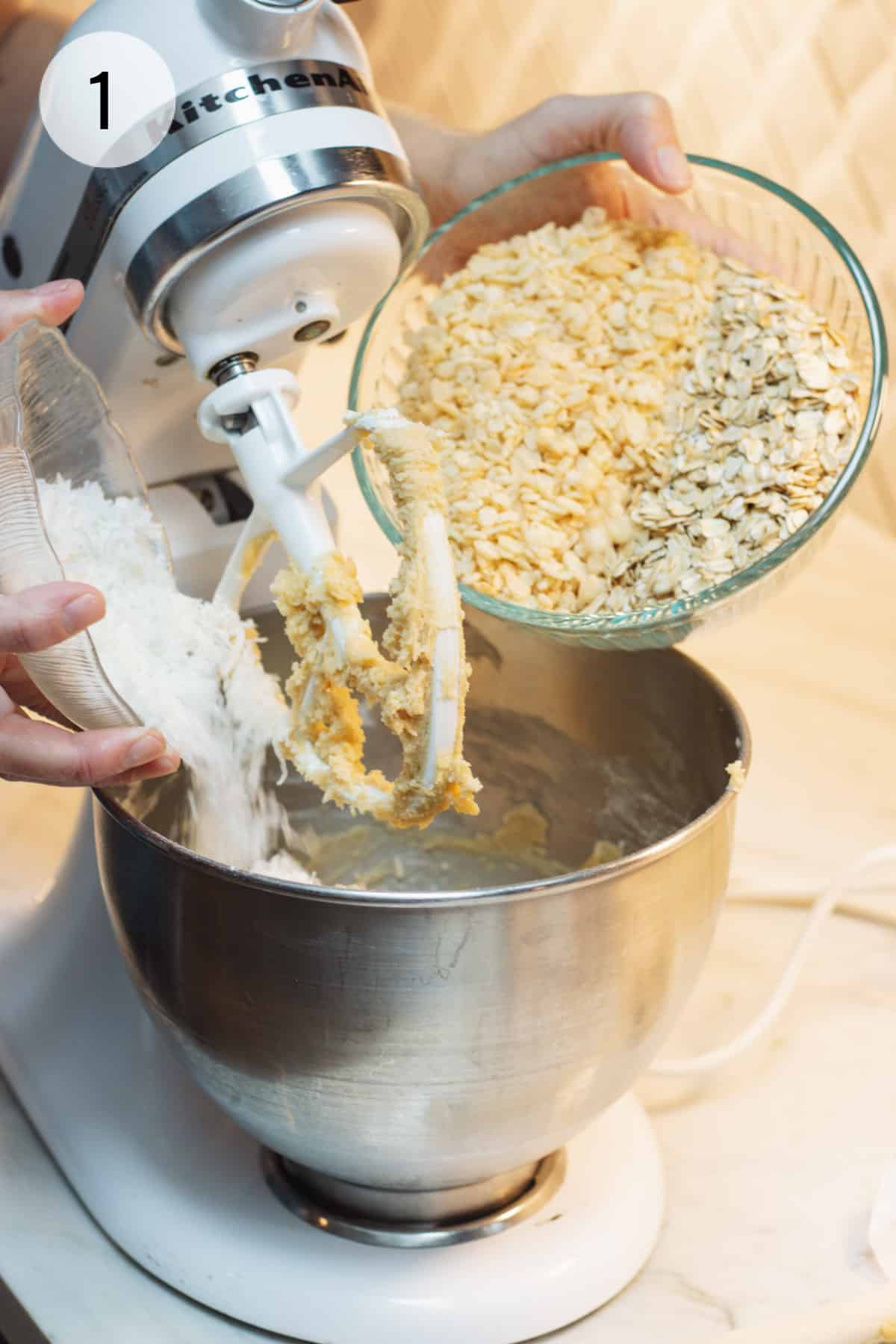 Pour dry ingredients for Cracker Jack Rice Krispie Cookies into mixer bowl of a stand mixer. 