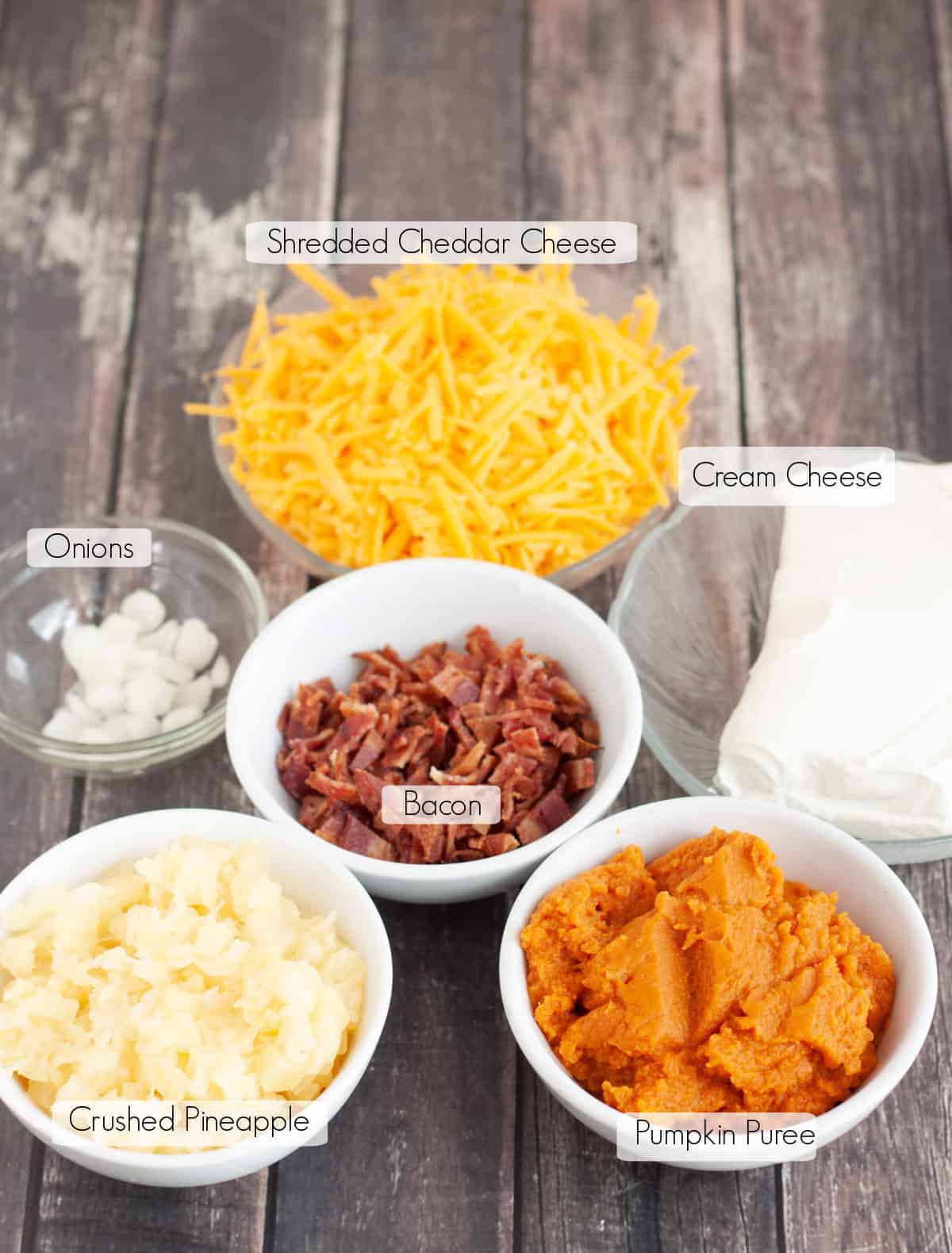 Labeled bowls of ingredients to make easy pumpkin cheeseball. 