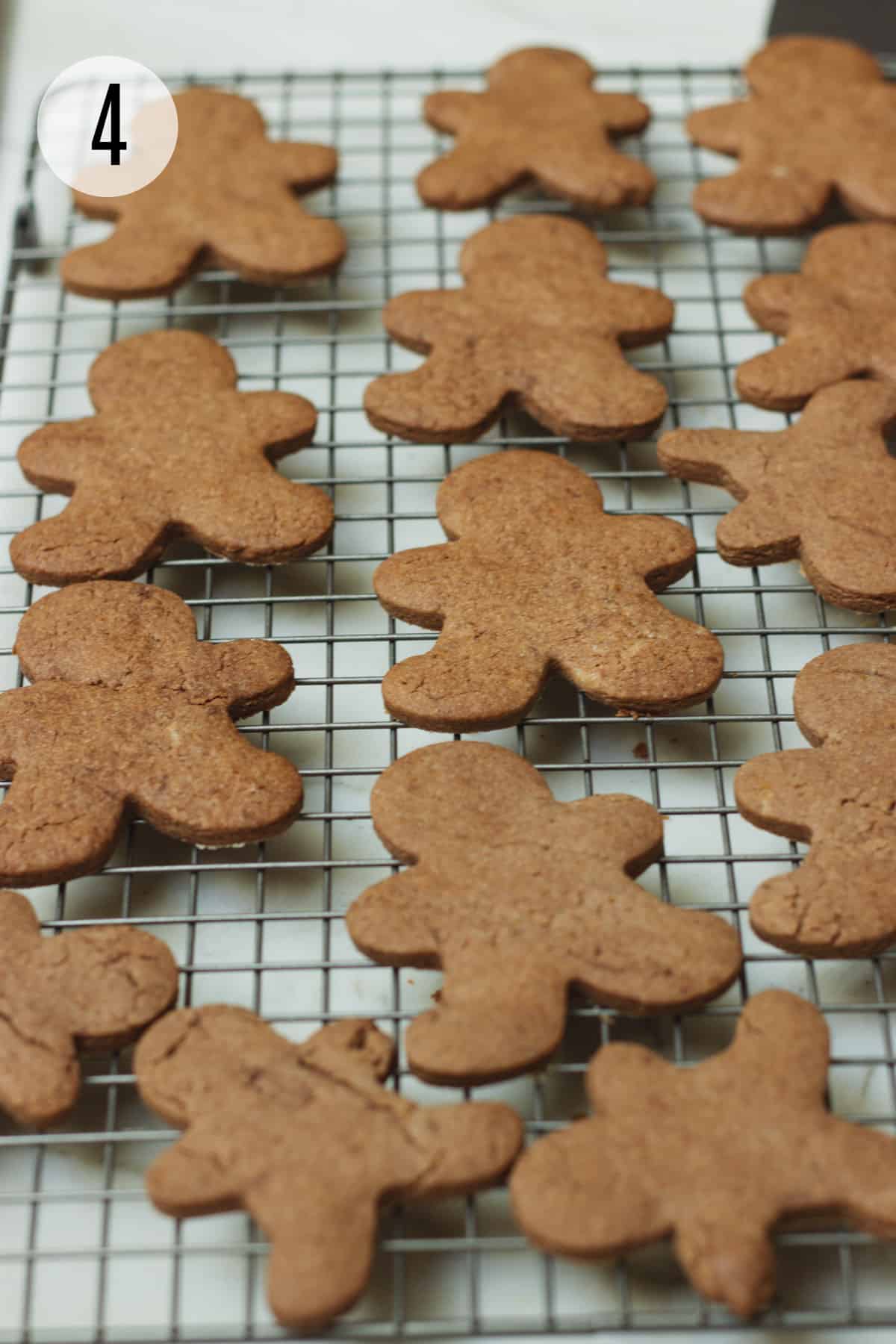 Baking rack with gingerbread man shaped Mexican chocolate sugar cookies. 