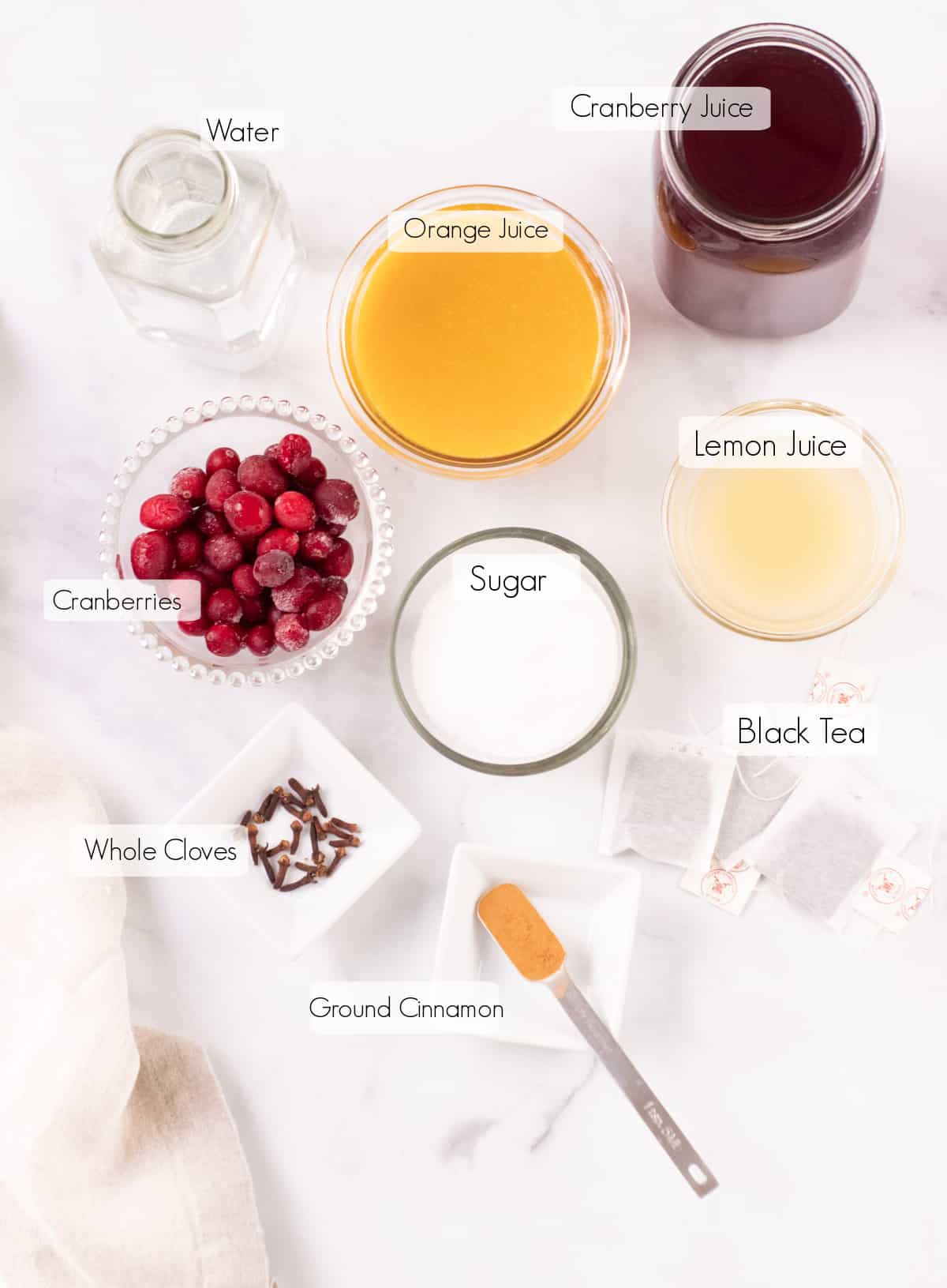 Labeled ingredients to make orange cranberry tea concentrate.