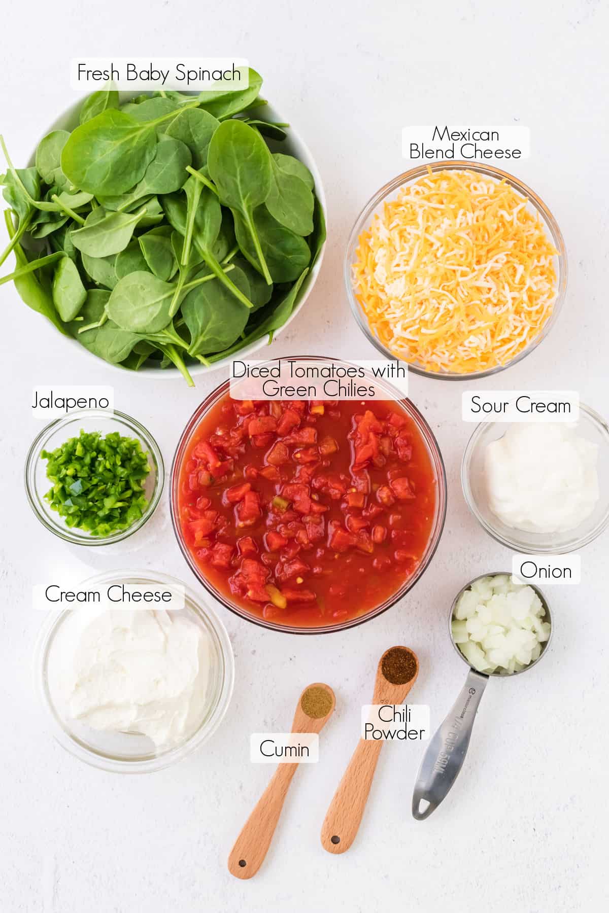Labeled ingredients to make spinach queso dip.